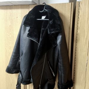 Jackey, black PU leather with fluffy inside. Size 38. Brand: NA-KD